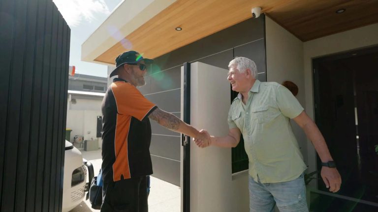 happy customer shaking hands with ozshut technician